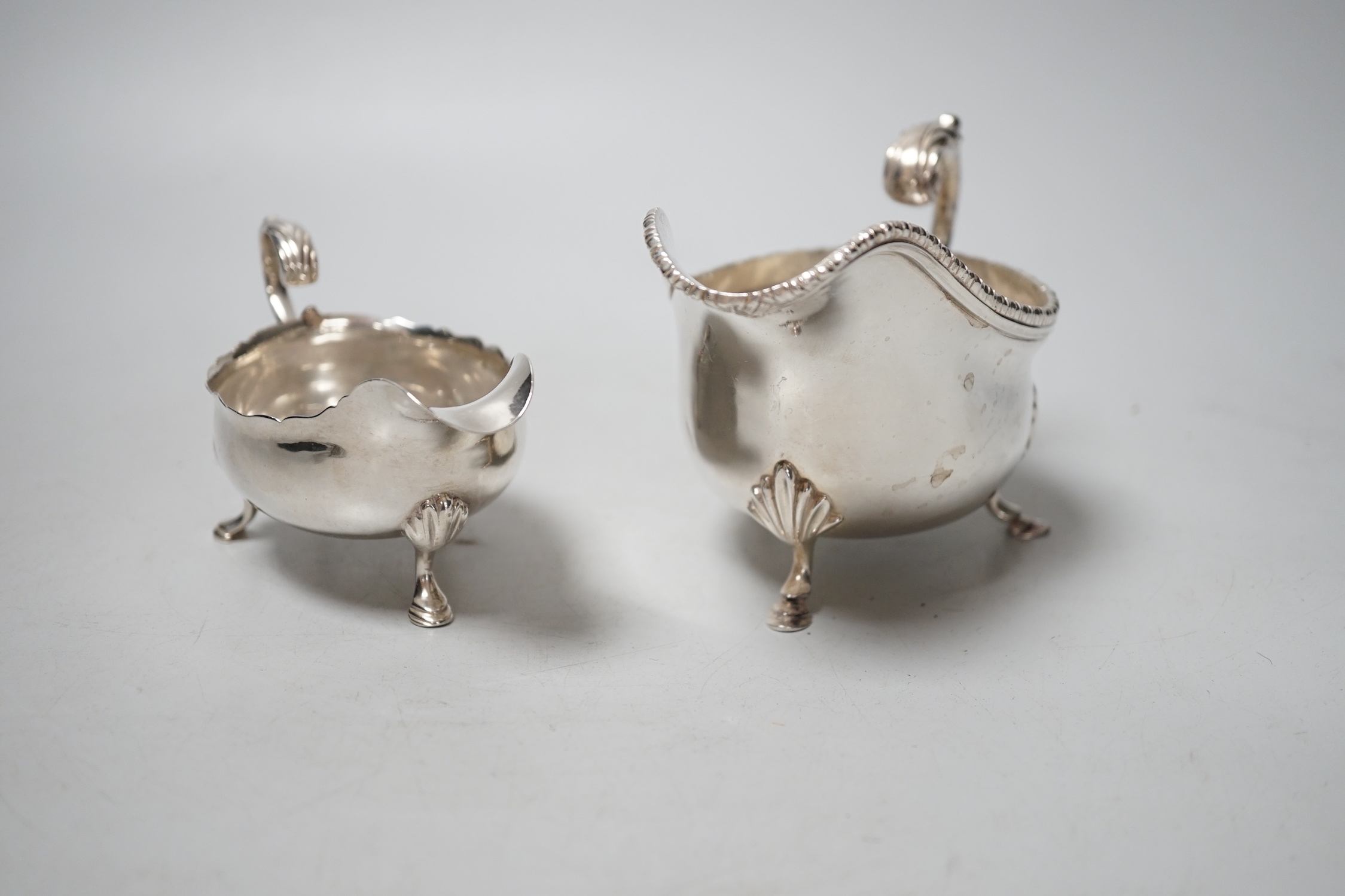 A George III silver sauceboat, London, 1759 and a later sauceboat, 10.8oz.